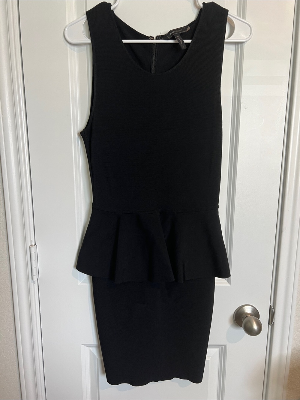 BCBGMaxAzria Black Sleeveless Peplum Midi Sheath Dress